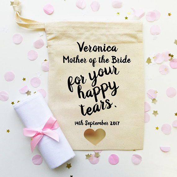 keepsakegiftbagforthemotherofthebridehandkerchieftiedwithabow.