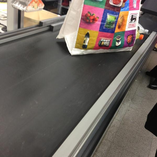 Photo taken at Proxy Delhaize by Tim on 2/20/2013