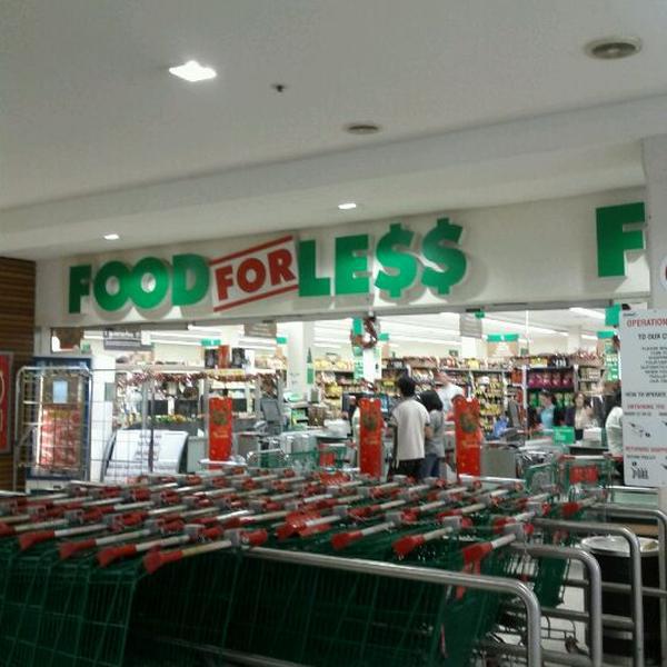 Photo taken at Woolworths by Sean S. on 12/16/2011