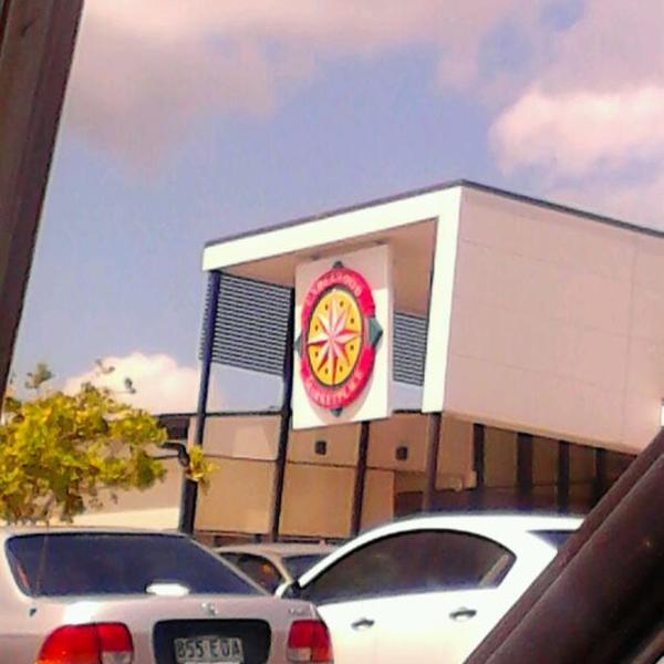 Photo taken at Big W by Aaron P. on 10/12/2011