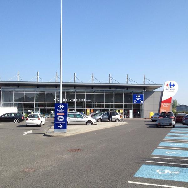 Photo taken at Carrefour Market by Bernard V. on 4/13/2014