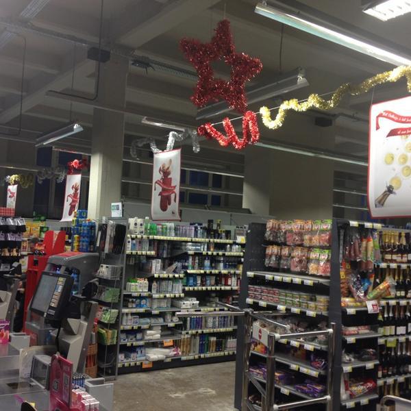 Photo taken at Proxy Delhaize by Grégoire P. on 12/20/2012