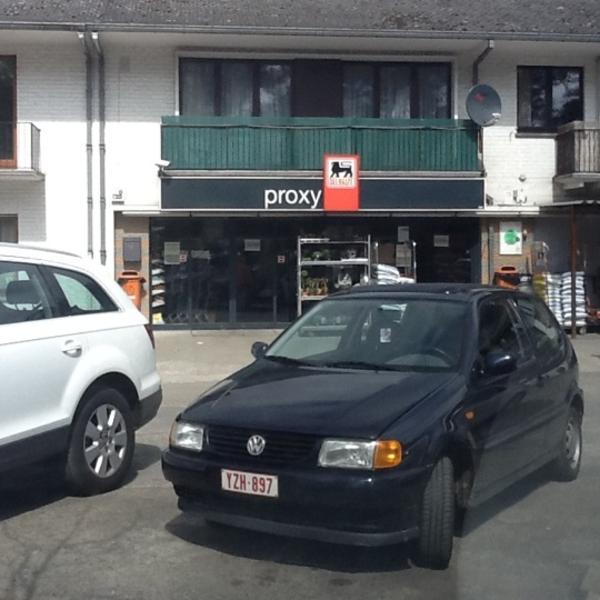 Photo taken at Proxy Delhaize by Wim H. on 4/15/2012