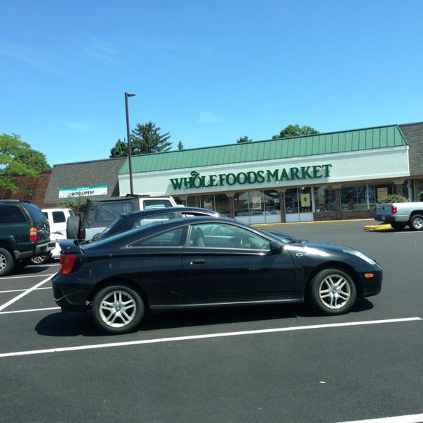 Photo taken at Whole Foods Market by Erin T. on 7/31/2013
