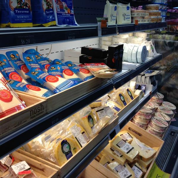 Photo taken at Nosh Food Market by Rebecca D. on 1/8/2013