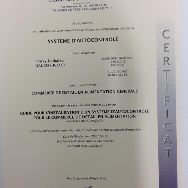 Photo taken at Proxy Delhaize by Tanguy V. on 12/26/2012