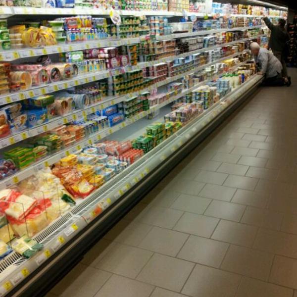 Photo taken at Proxy Delhaize by Mark B. on 5/12/2012