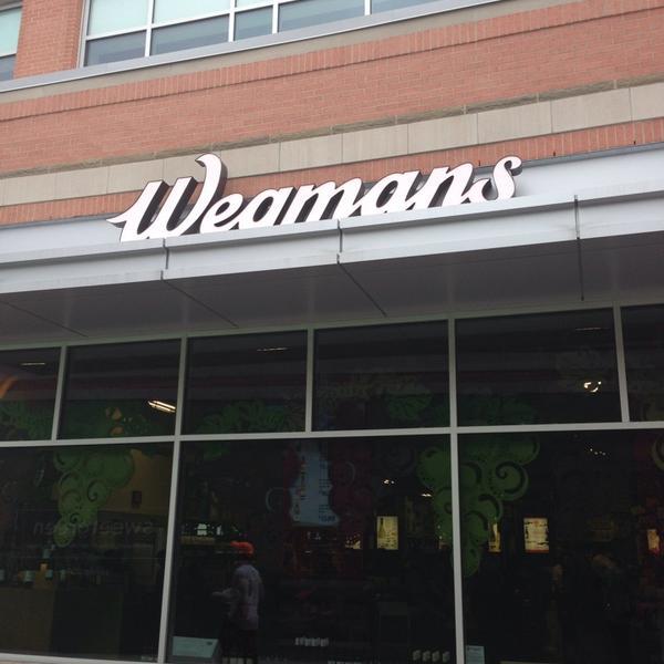 Photo taken at Wegmans by Lauren S. on 4/27/2014